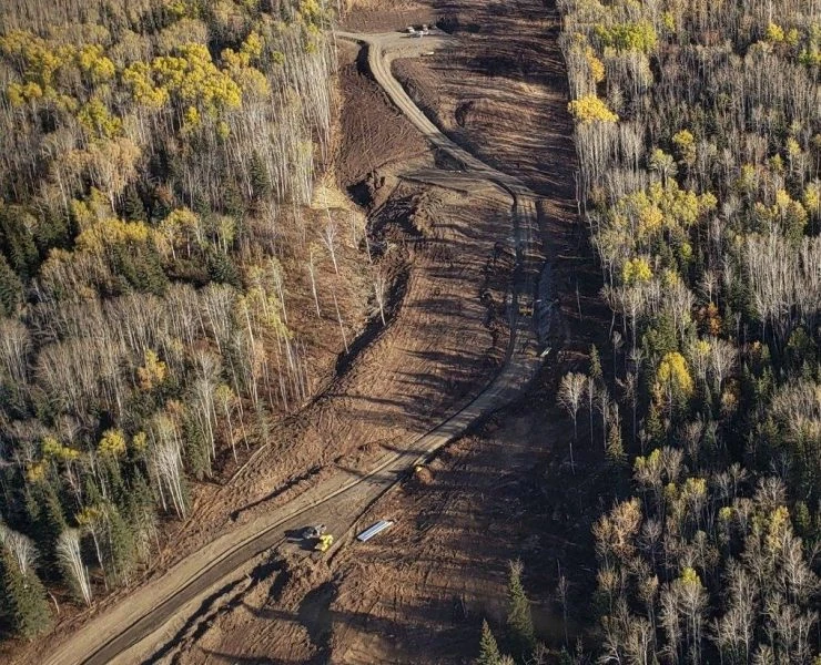 Aerial view of ACL’s access-road construction through forest for the BC Hydro PRES Transmission Line