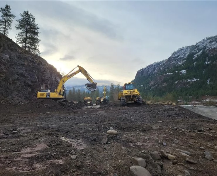 Excavators loading rock ACL Construction Fort St. John Flood Mitigation Repairs Road Repairs