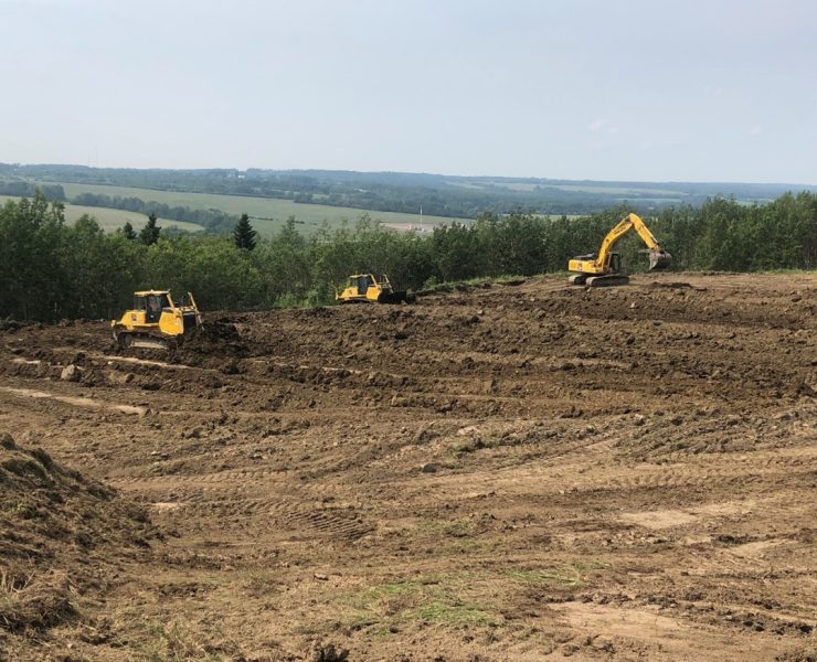 Spreading backfill to complete reclaim of site